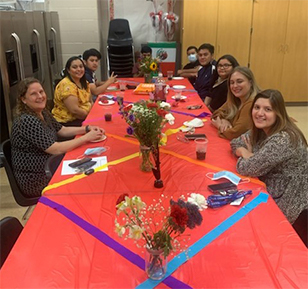 teachers-sitting-at-table-ready-to-celebrate-the-end-of-the-year